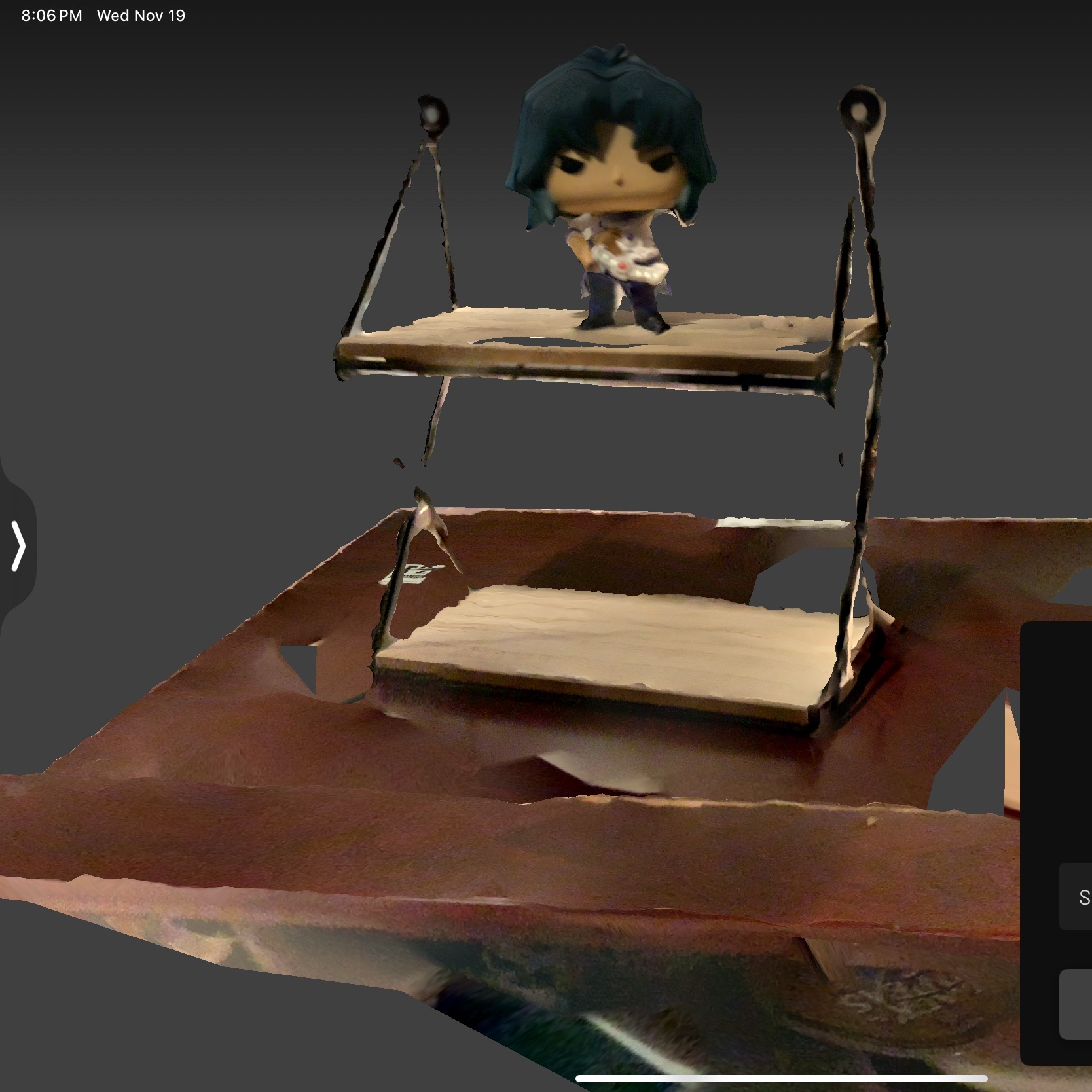 I wanted to play around with scanning on top of another object, having the shelf display act akin to a platform, hoping I would capture another angle of the figurine as a result. 