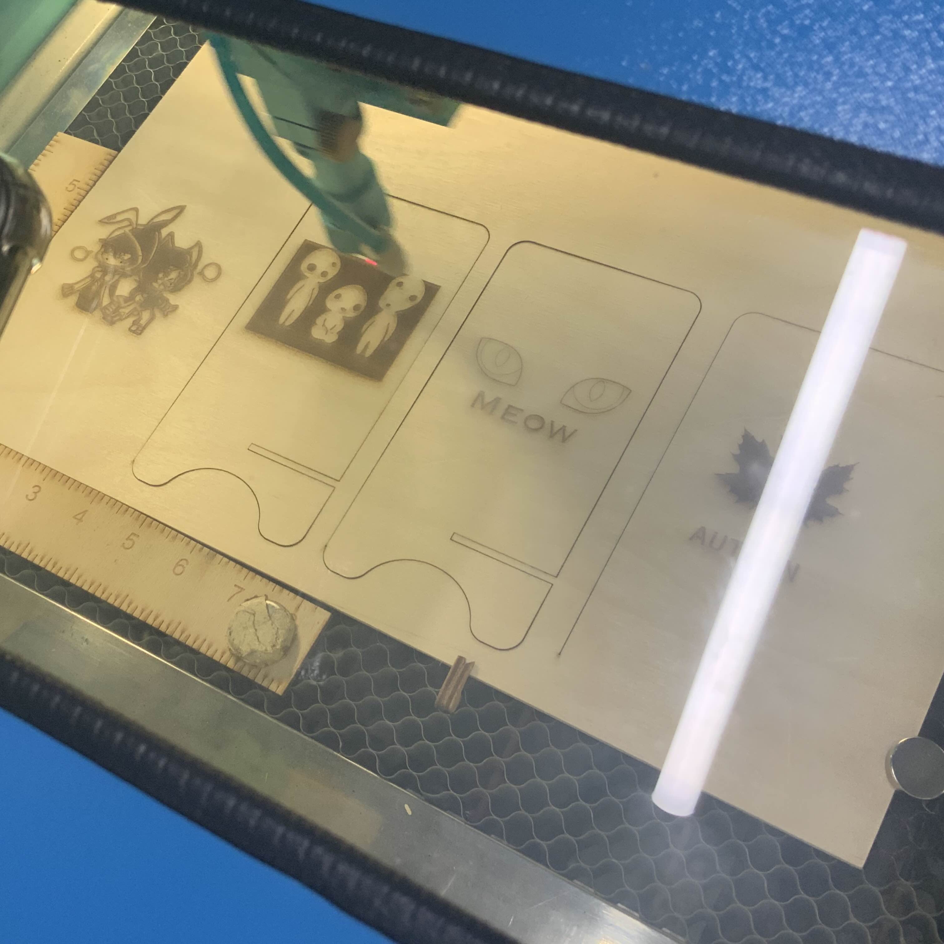 I stayed around for most of the process and used my phone to record the laser cutter doing its job while I took additional pictures using my ipad. By the time I had gotten my ipad from the classroom, the laser cutting Process was already 1/4 completed. It was interesting that it works horizontally and on all the images at once, rather than one image at a time. I found it interesting that it was cutting all of them at the same time, seeing it rapidly move from right to Left was super cool and its very fun to watch in the timelapse.