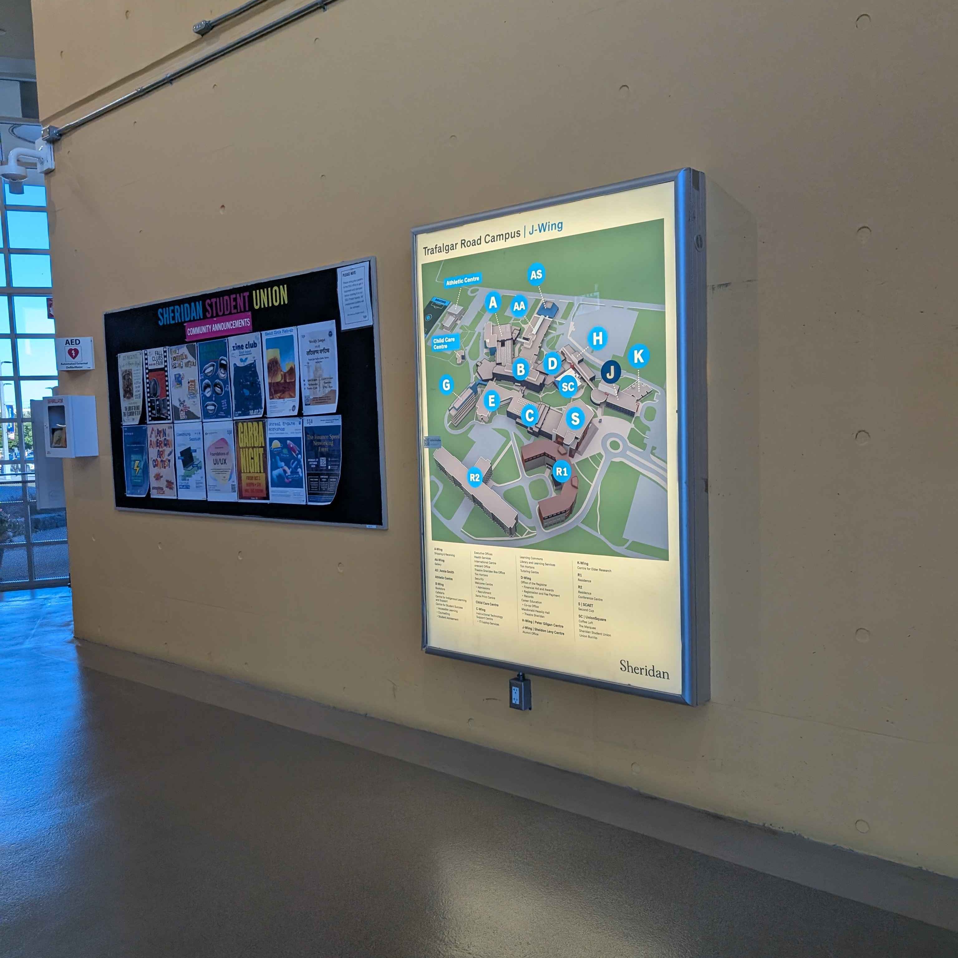 A picture of a wall in the J building that features a Map. I thought it would be interesting to photograph this wall or area in particular purely for the fact that it's a landmark since it features a map, something that someone who's unfamilliar with the layout of the campus would look for to figure out where to go